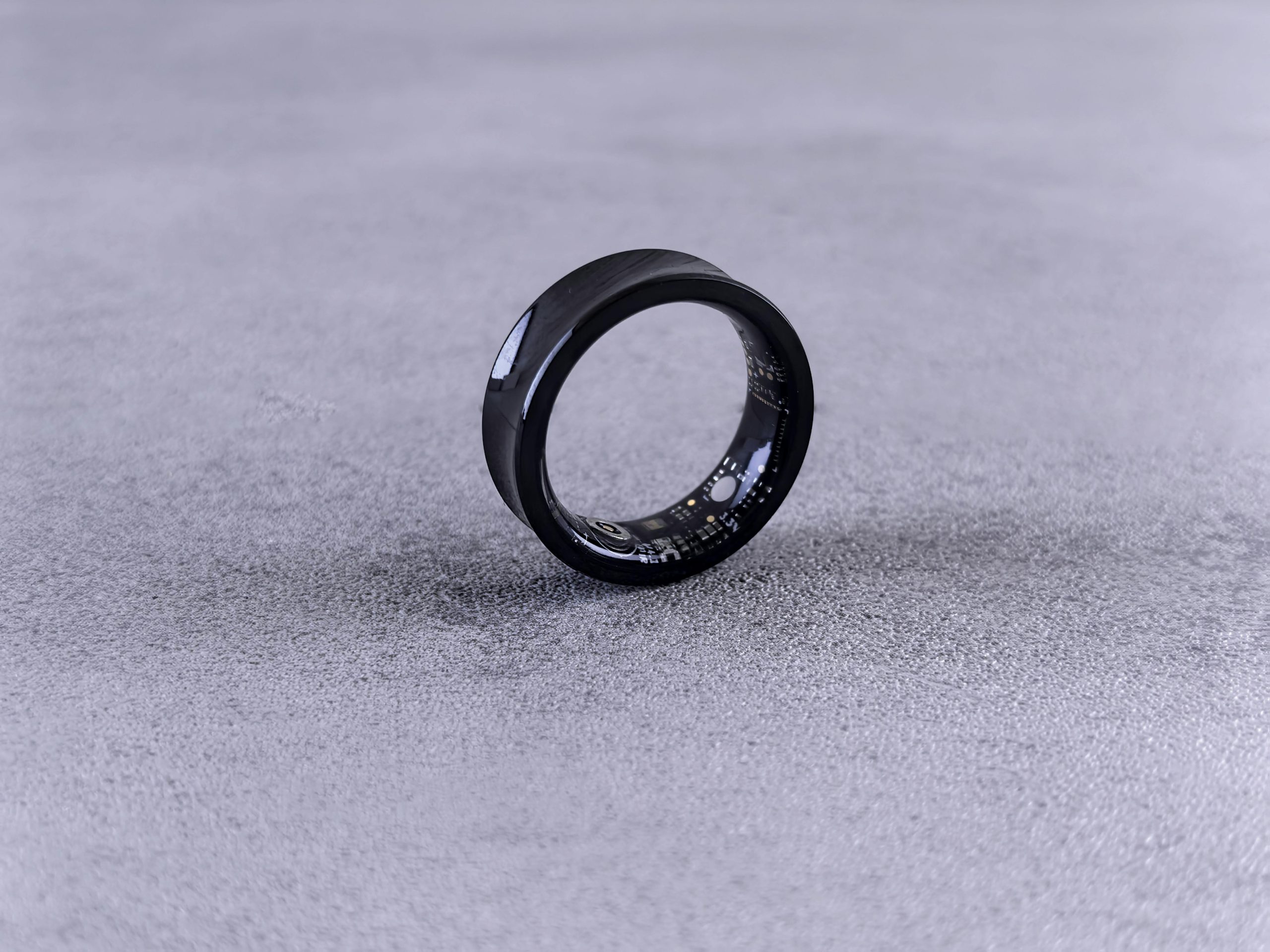Sleek Apple Smart Ring concept on a dark background for 2026 tech
