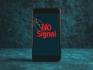 A mobile phone showing no service during the massive telecom network outage today