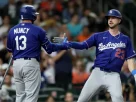 Los Angeles Dodgers players celebrating a play against the Houston Astros