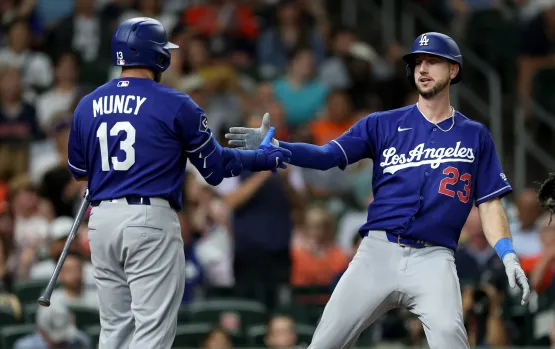 Los Angeles Dodgers players celebrating a play against the Houston Astros