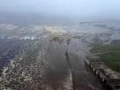 A massive tsunami warning causing huge dangerous waves near a coastal town