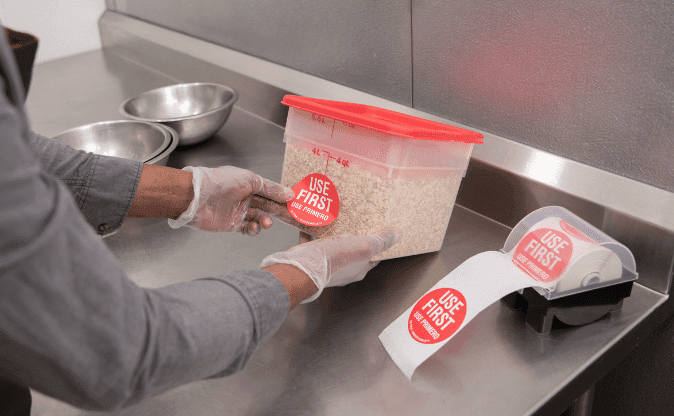 A person following the New FDA health alert by checking food labels in the kitchen