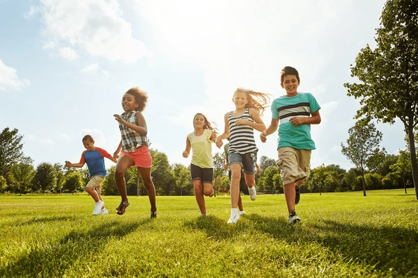A happy family following the summer virus warning while playing outside