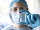 A professional doctor holding a medical vial during the bird flu warning