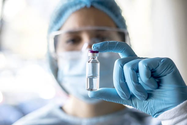 A professional doctor holding a medical vial during the bird flu warning