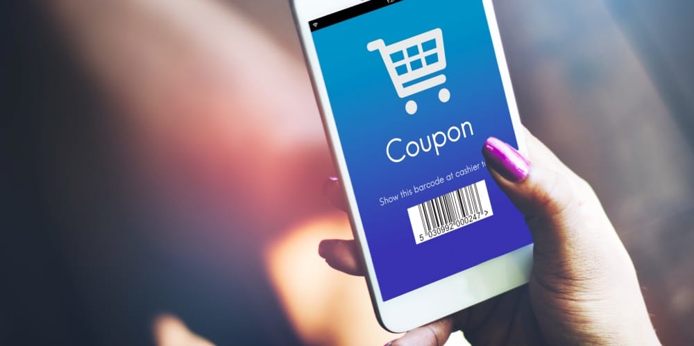 A person using a smartphone to find massive online shopping discounts