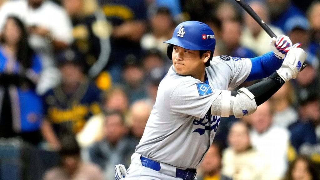 Shohei Ohtani reacting at the plate during a game