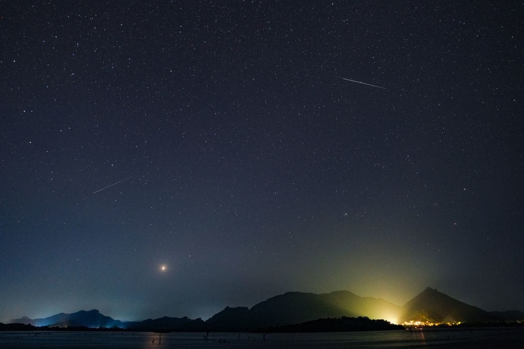 A stunning view of the meteor shower peak with many shooting stars in the night sky