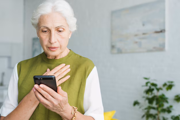 A worried senior citizen receiving a fake call about a Medicare scam warning
