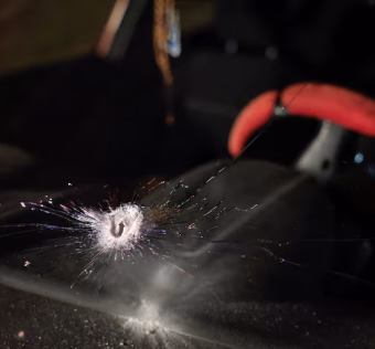 A bullet hole in a car window showing the tragic West Bank baby shooting incident today