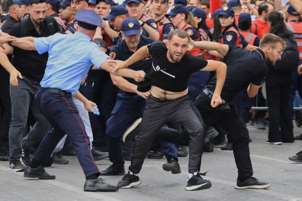Protesters tearing down fences during the Albanian coastal development protests today